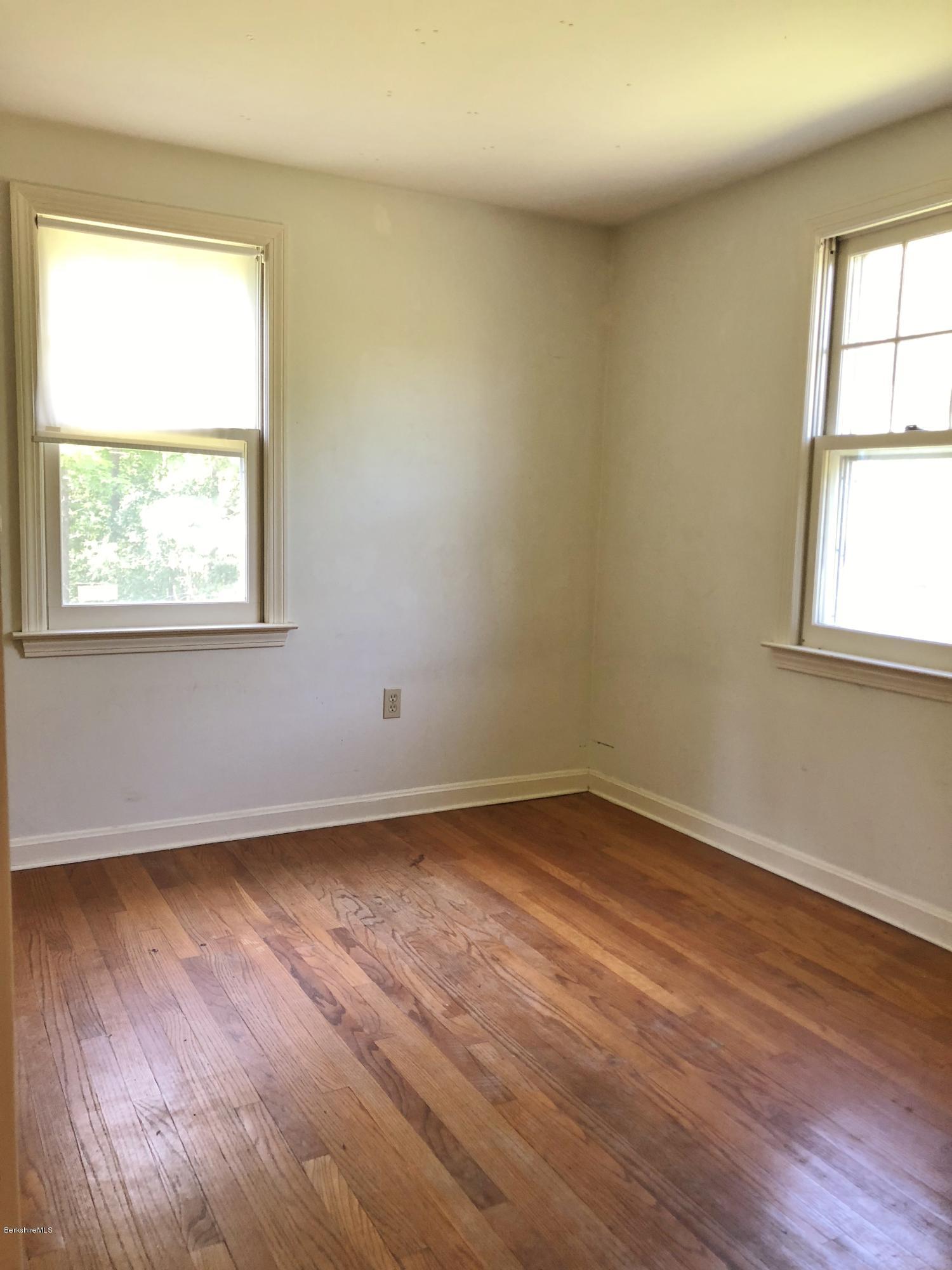 1499 State Road Richmond, MA 01254 - Photo 10 of 25 an empty room with wooden floor and windows
