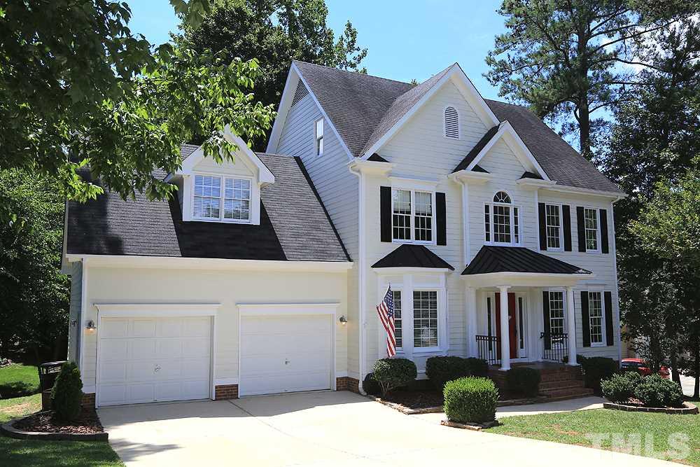 Super curb appeal, covered entry porch, attractive landscaping, convenient location!