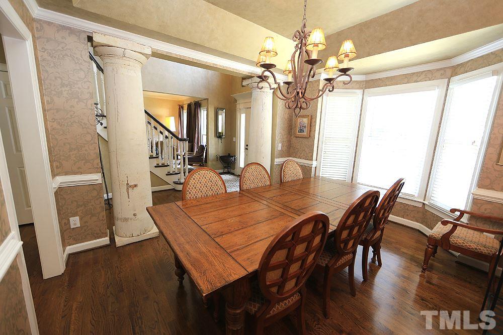 7812 Mayapple Place Raleigh, NC 27613 - Photo 13 of 30 The pillars are decorative and are not structural. They will stay with the house.