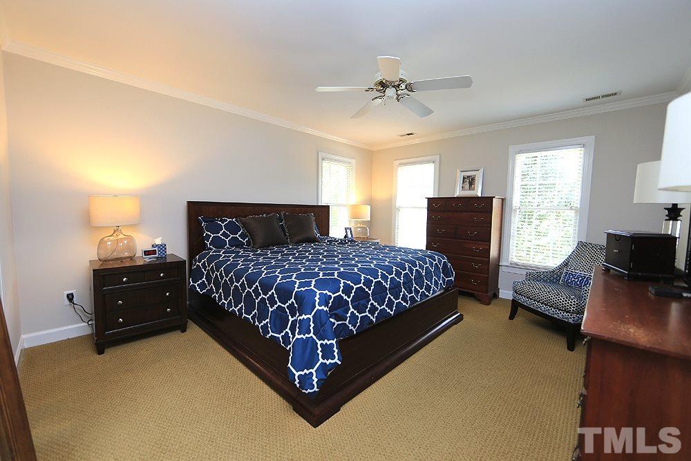 7812 Mayapple Place Raleigh, NC 27613 - Photo 14 of 30 The master bedroom shares no walls with other bedrooms. It has a large walk in closet.
