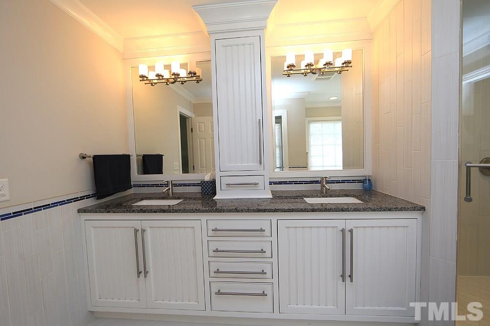 7812 Mayapple Place Raleigh, NC 27613 - Photo 15 of 30 Love the double vanities, great lighting and all the storage. Granite countertops, large tile floor, pocket door to water closet.