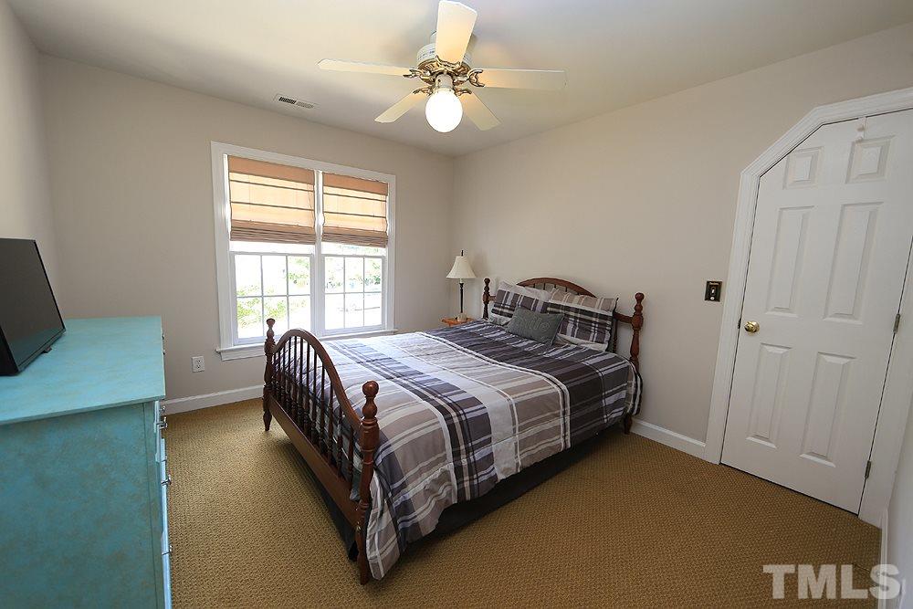 7812 Mayapple Place Raleigh, NC 27613 - Photo 17 of 30 This bedroom looks out on the front.