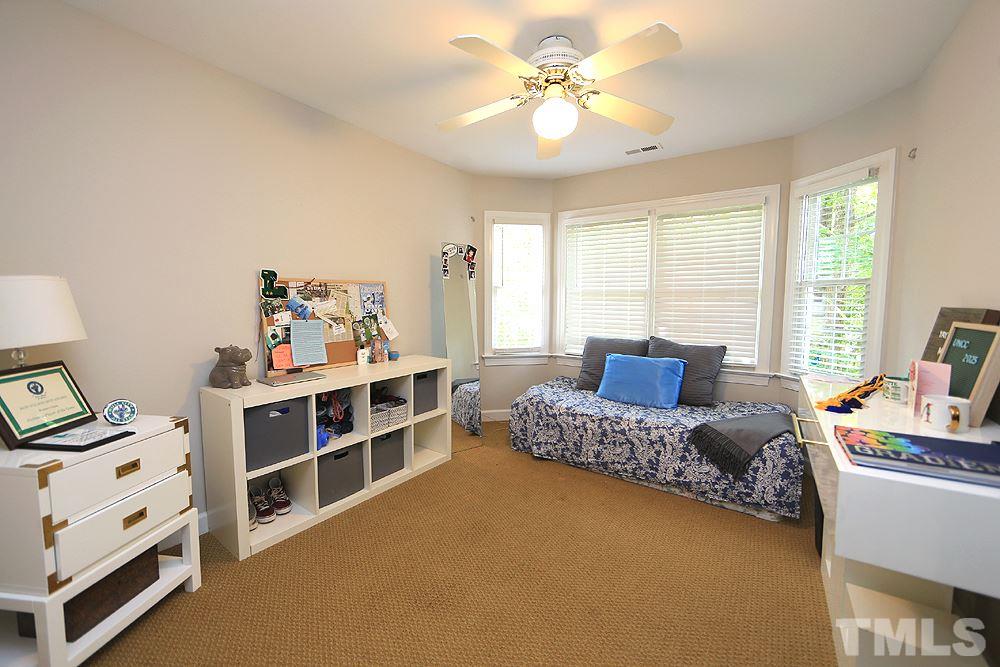 7812 Mayapple Place Raleigh, NC 27613 - Photo 18 of 30 This bedroom has a bay window and looks out to the backyard.