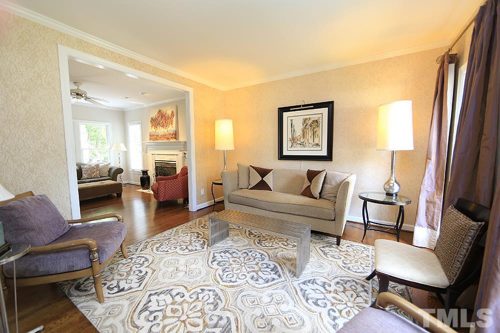 7812 Mayapple Place Raleigh, NC 27613 - Photo 4 of 30 Hardwoods and crown molding throughout downstairs.