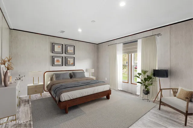 a spacious bedroom with a bed couch and a window