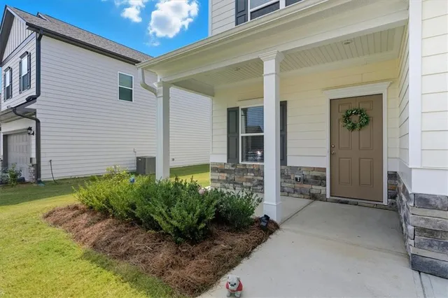 a view of a backyard with potted plants