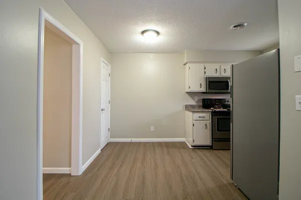a view of kitchen with microwave and stove