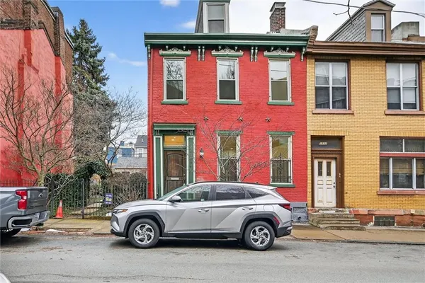 a car parked in front of a house