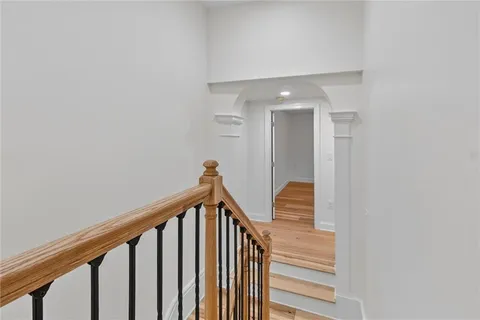 a view of a hallway with staircase