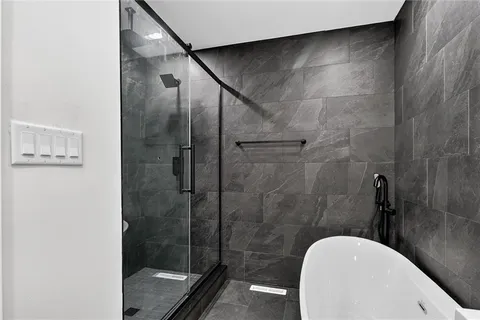 a bathroom with a shower and toilet