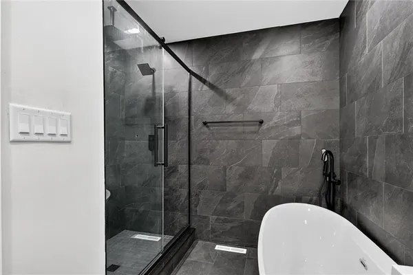 a bathroom with a shower and toilet