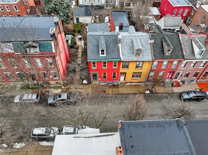 a utility room with lots of clutter and bicycles