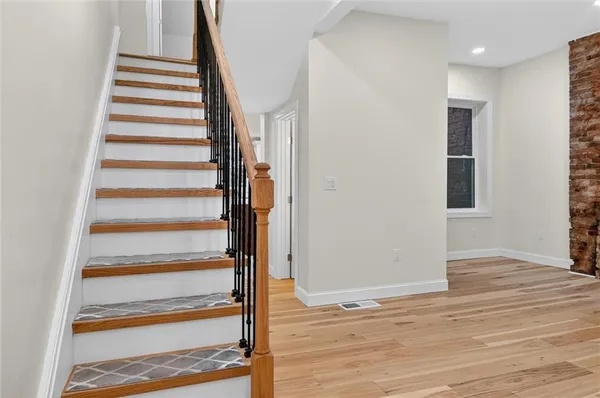 a view of entryway with wooden floor and chair