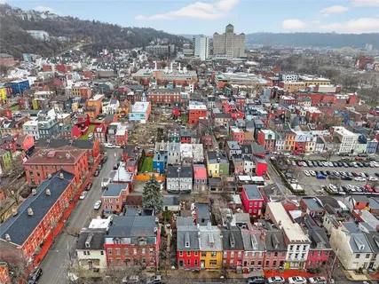 a front view of a building with blue umbrellas