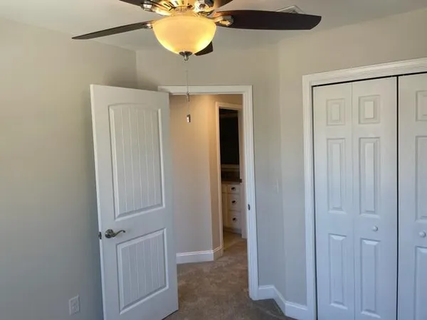 an empty room with a mirror