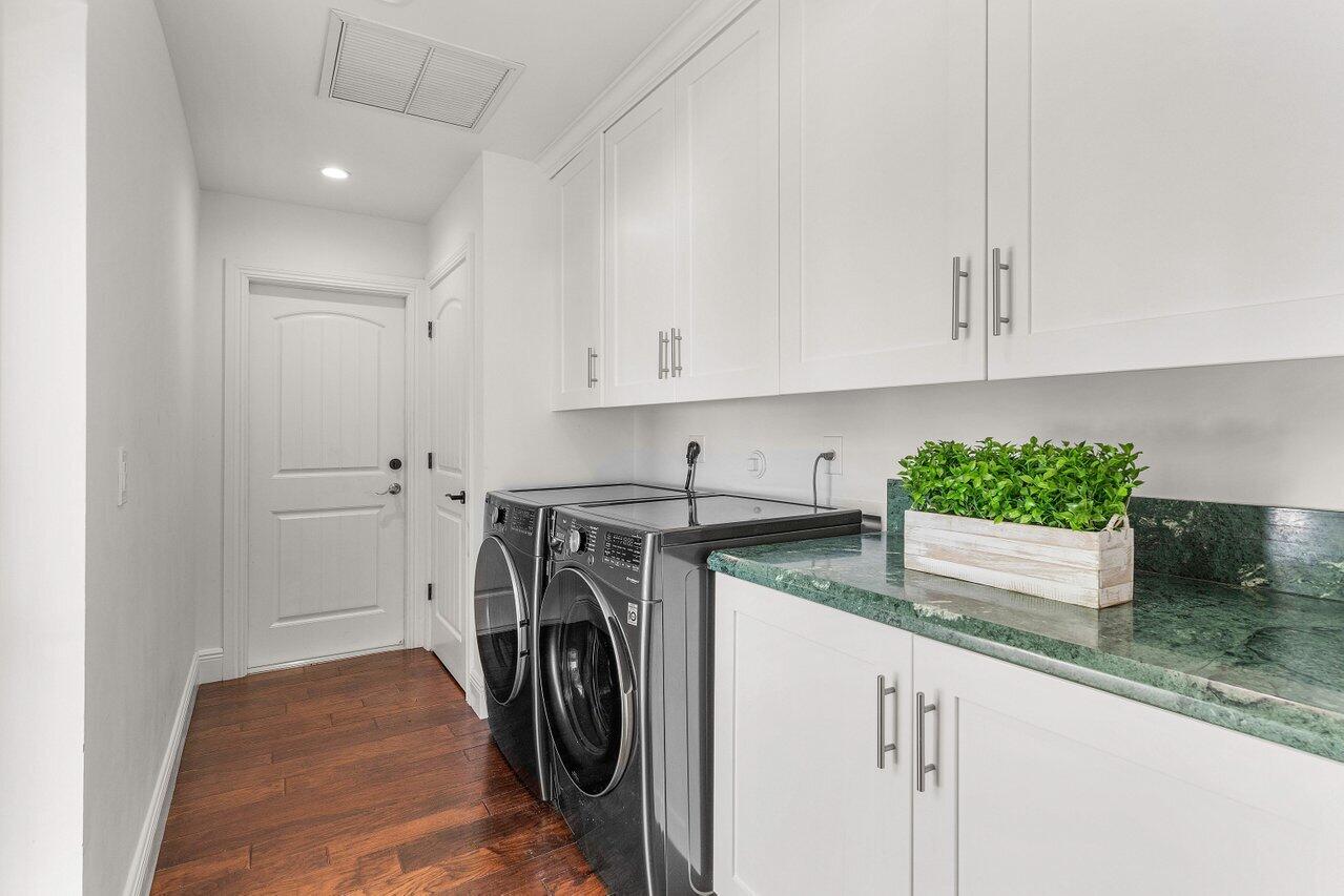 6130 Ridge Lane Ocean Ridge, FL 33435 - Photo 13 of 33 a utility room with granite countertop a sink and a stove top oven