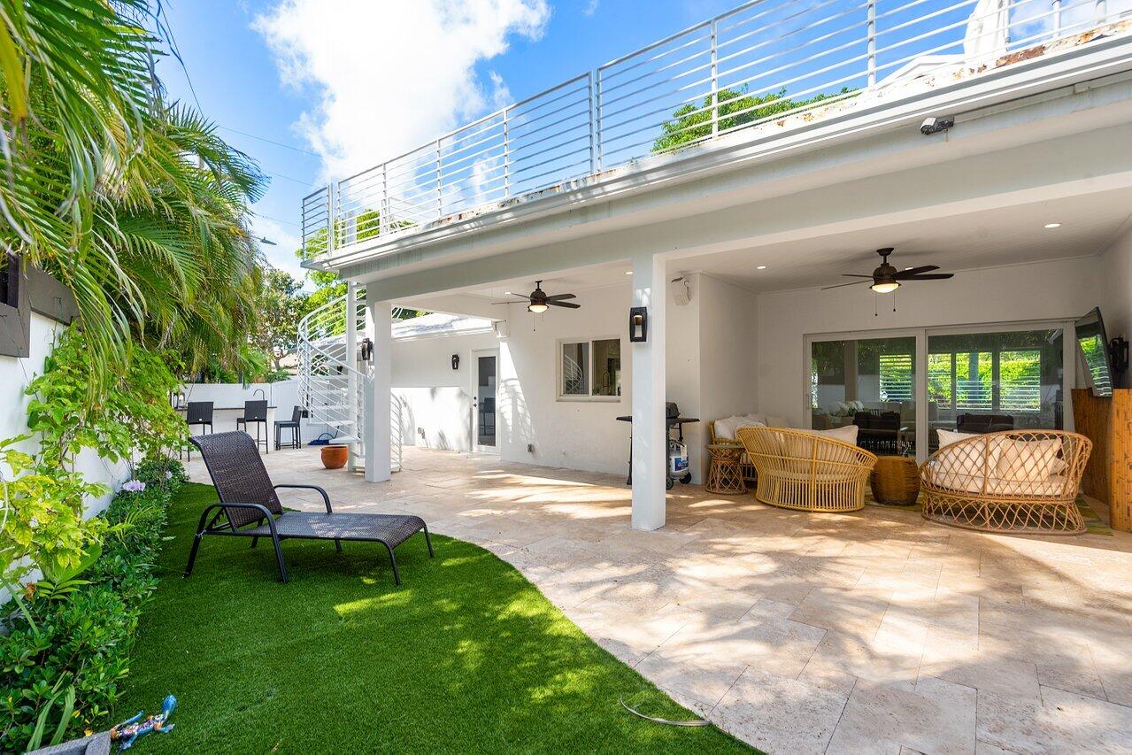 6130 Ridge Lane Ocean Ridge, FL 33435 - Photo 28 of 33 a view of a house with backyard and sitting area