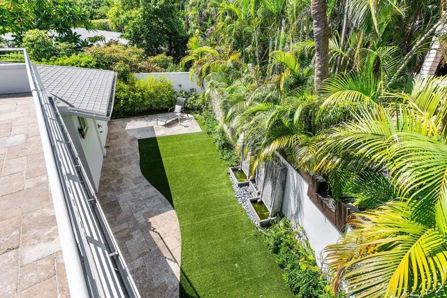 an aerial view of residential building and lake