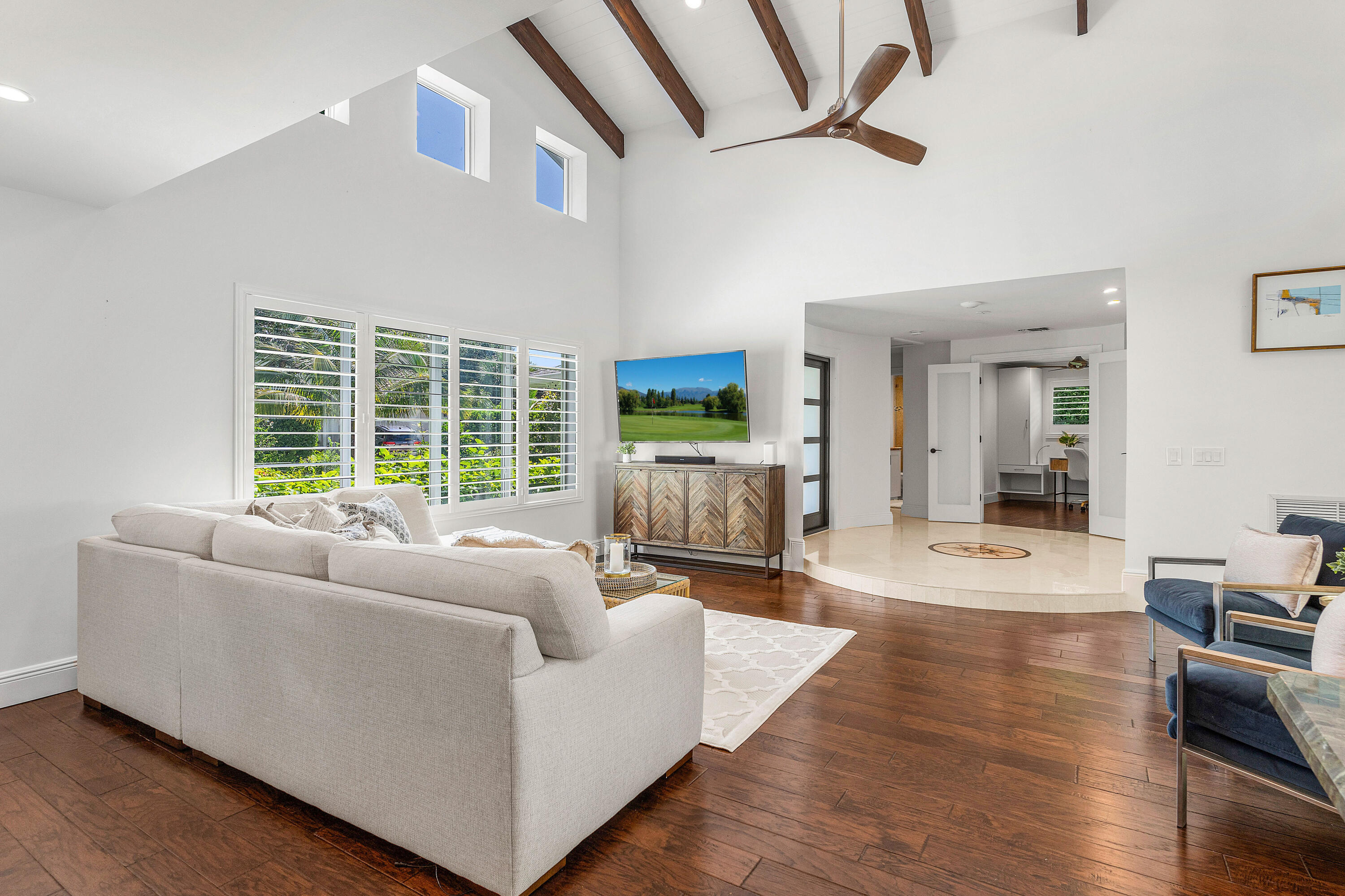 6130 Ridge Lane Ocean Ridge, FL 33435 - Photo 8 of 33 a living room with furniture large window and wooden floor