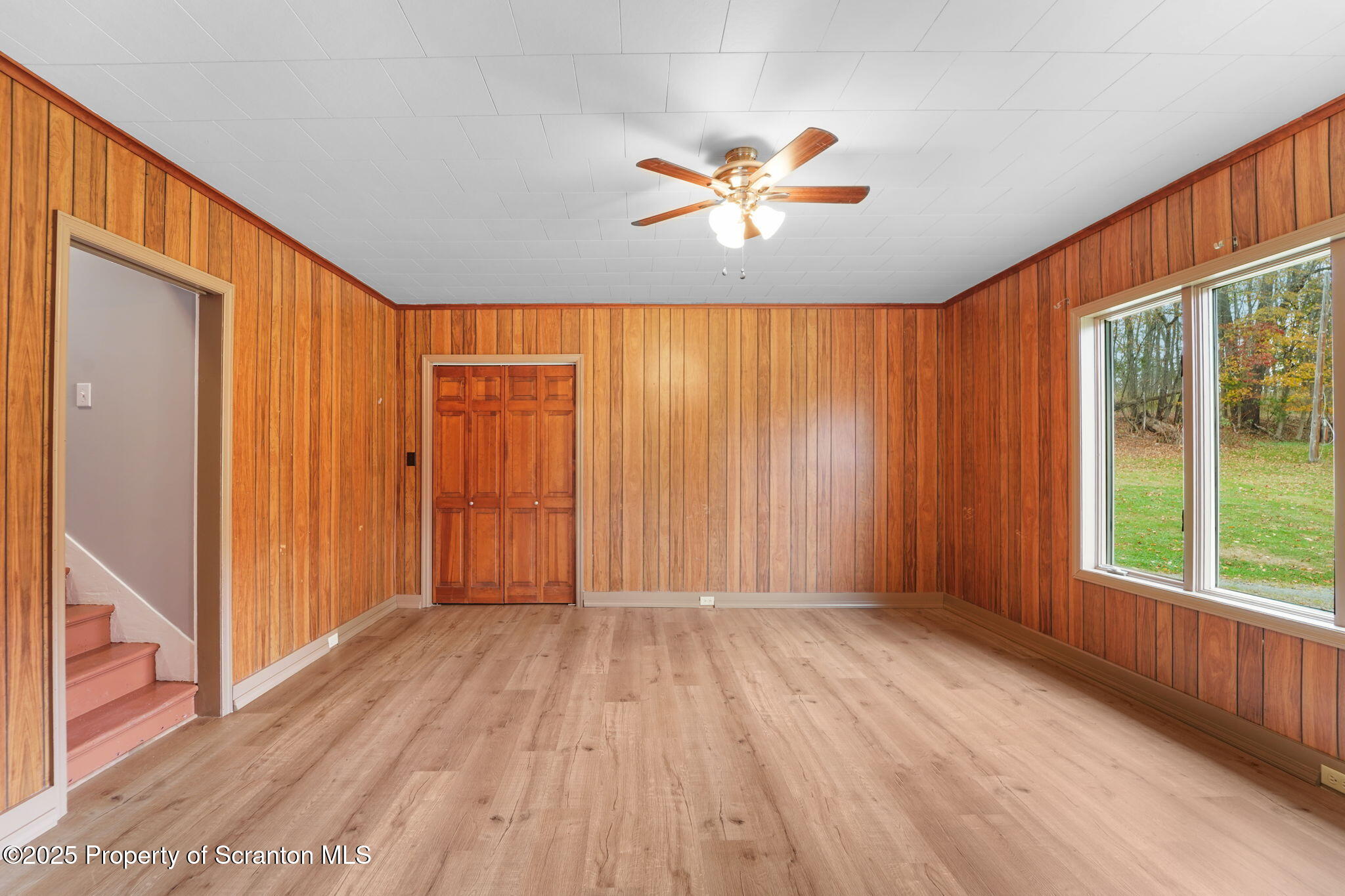 117 Church Road Harford, PA 18823 - Photo 13 of 35 a view of an empty room with a window and wooden floor