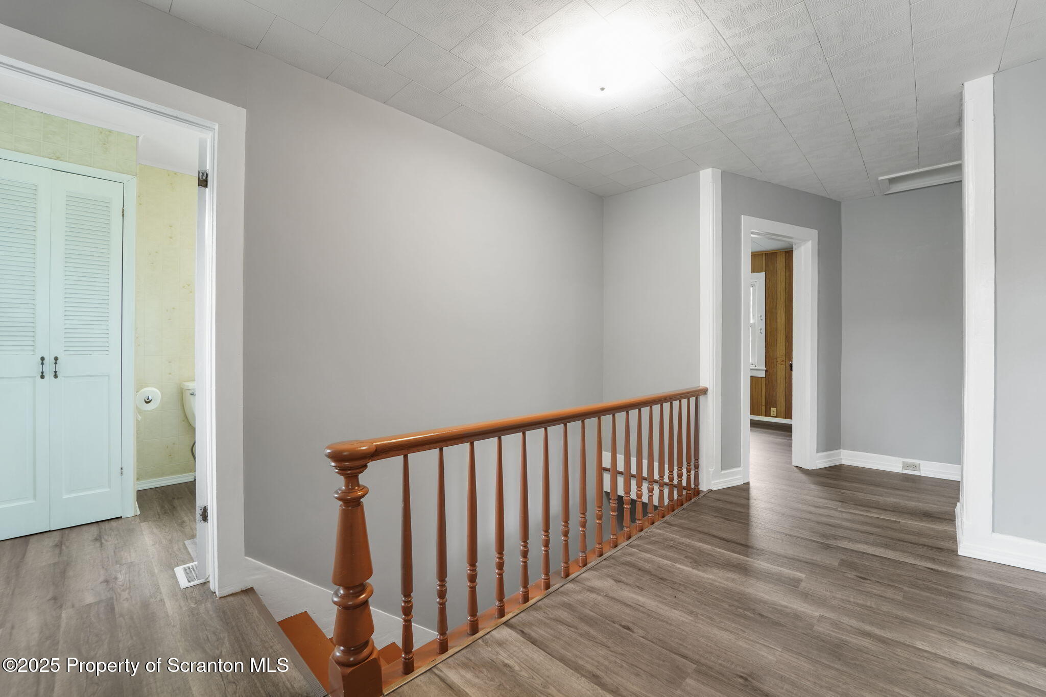 117 Church Road Harford, PA 18823 - Photo 18 of 35 a view of a hallway with wooden floor and a hallway