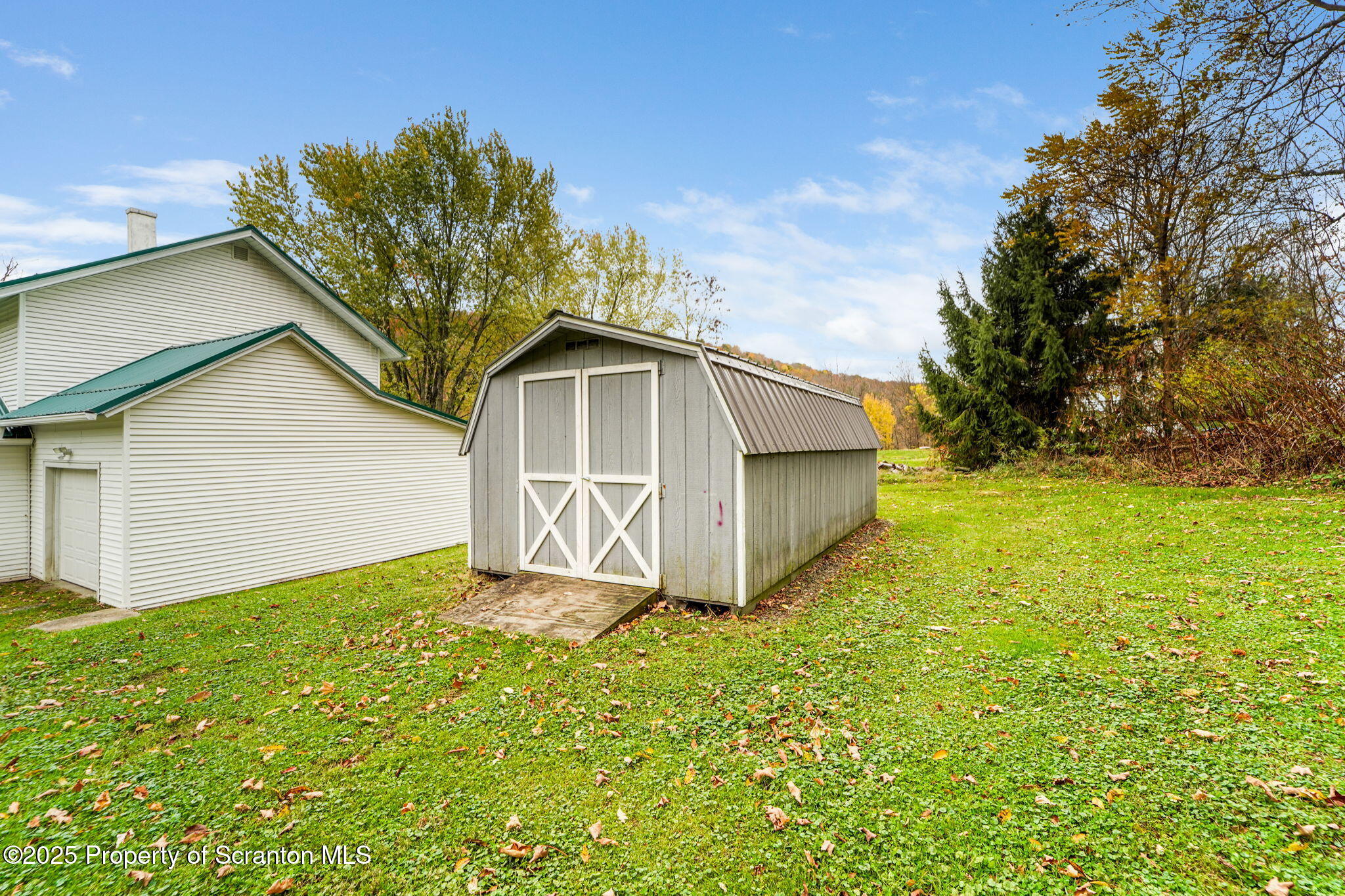 117 Church Road Harford, PA 18823 - Photo 26 of 35 a white house that has tree in front of it