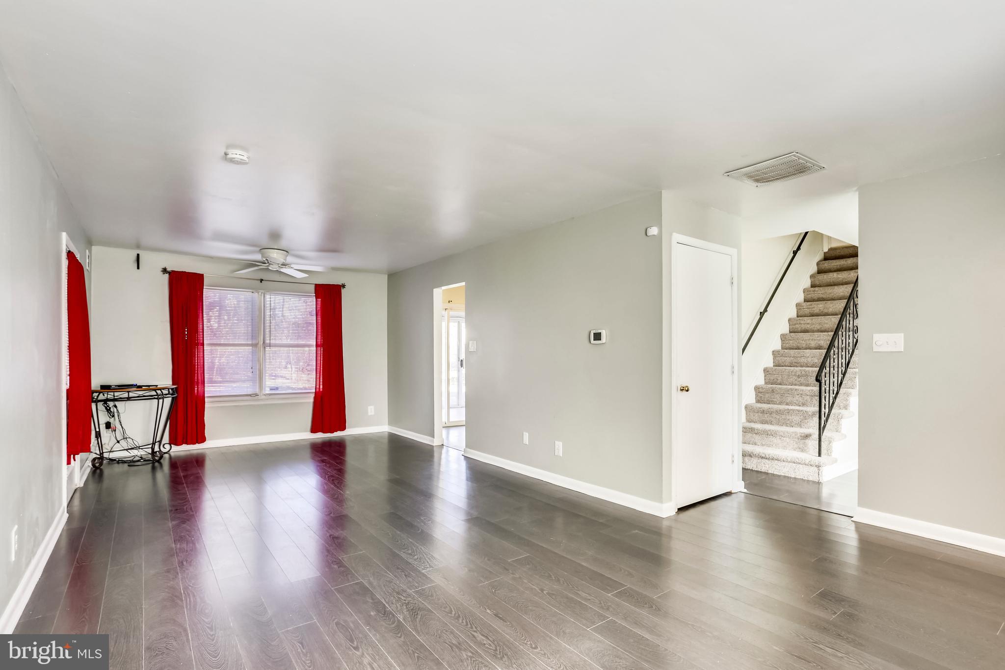 Home features wide-plank engineered hardwood