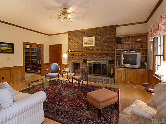 Step down into the family room with its massive hearth and built in firewood nook Den/Family/Great Room