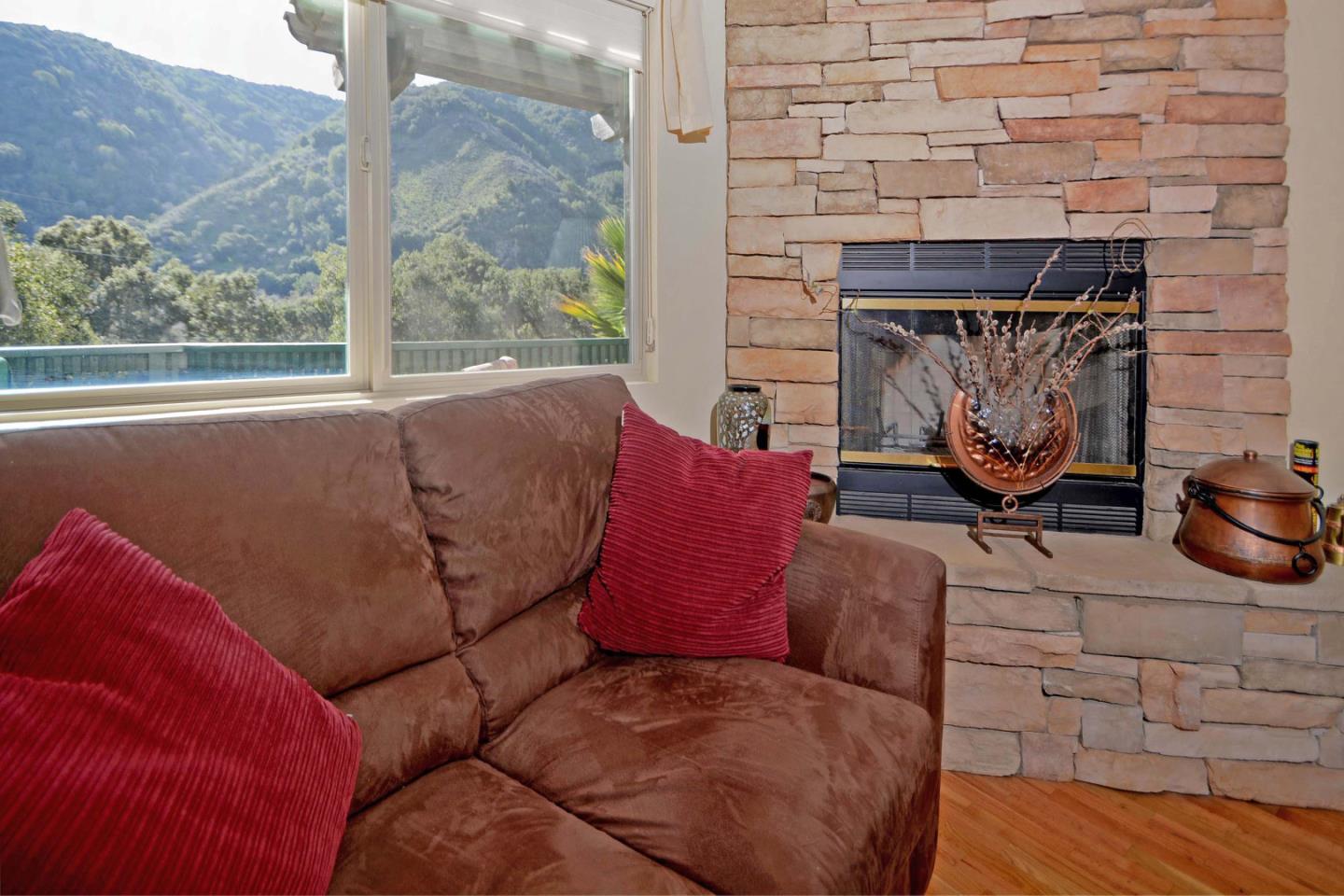 55 Paso Cresta Carmel Valley, CA 93924 - Photo 13 of 26 a living room with furniture and a fireplace