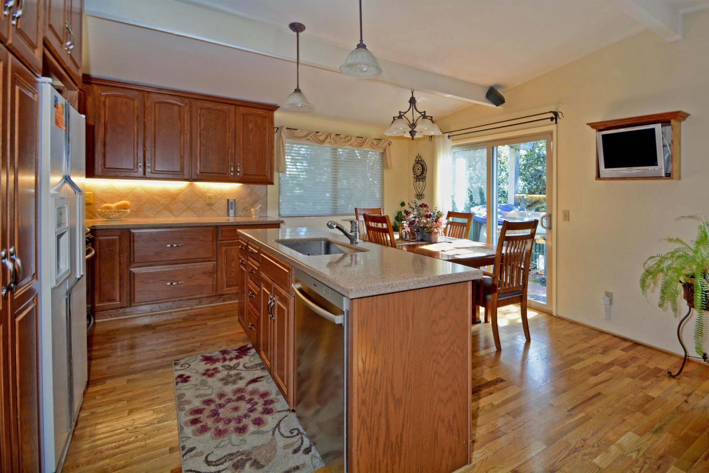 55 Paso Cresta Carmel Valley, CA 93924 - Photo 17 of 26 a kitchen with stainless steel appliances granite countertop a sink stove and refrigerator