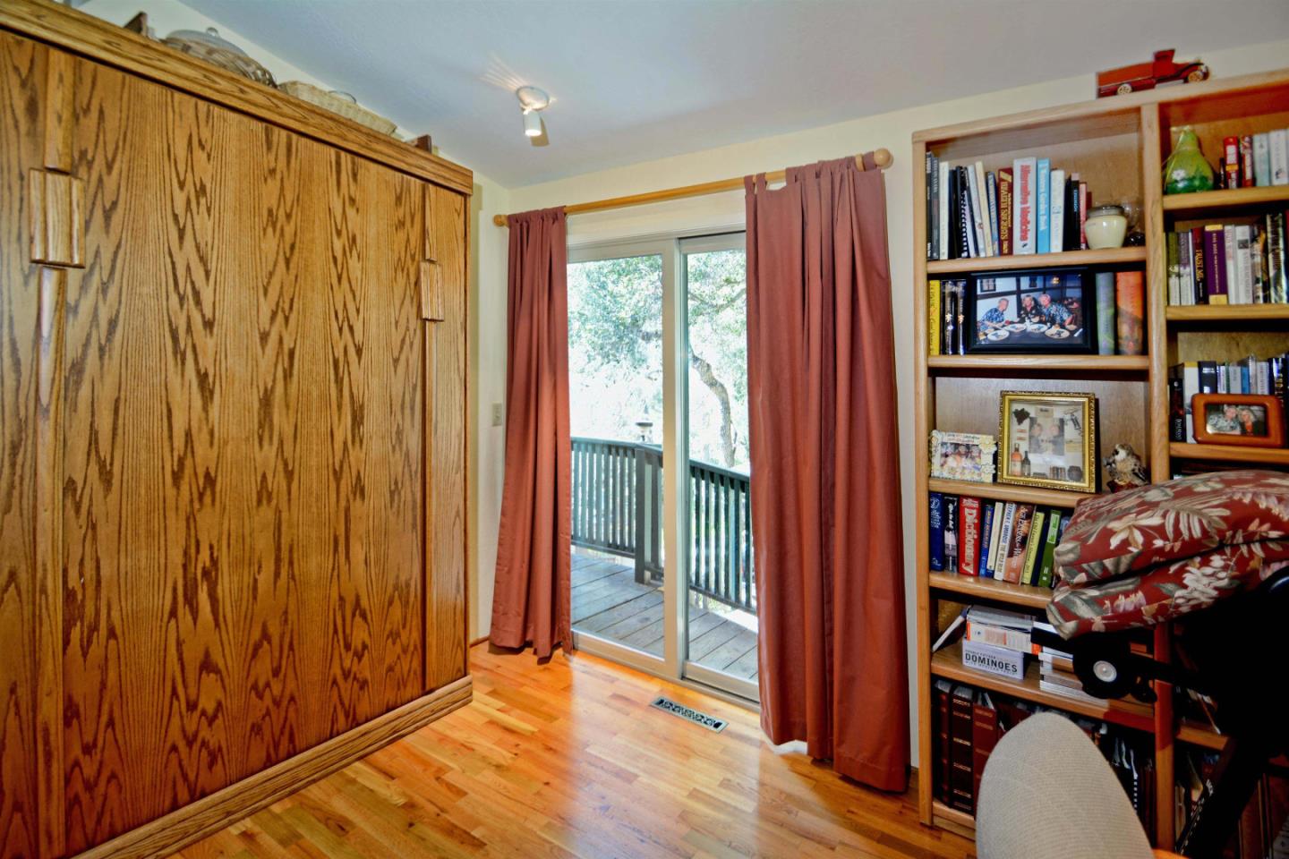55 Paso Cresta Carmel Valley, CA 93924 - Photo 19 of 26 a view of a livingroom with furniture and a book shelf