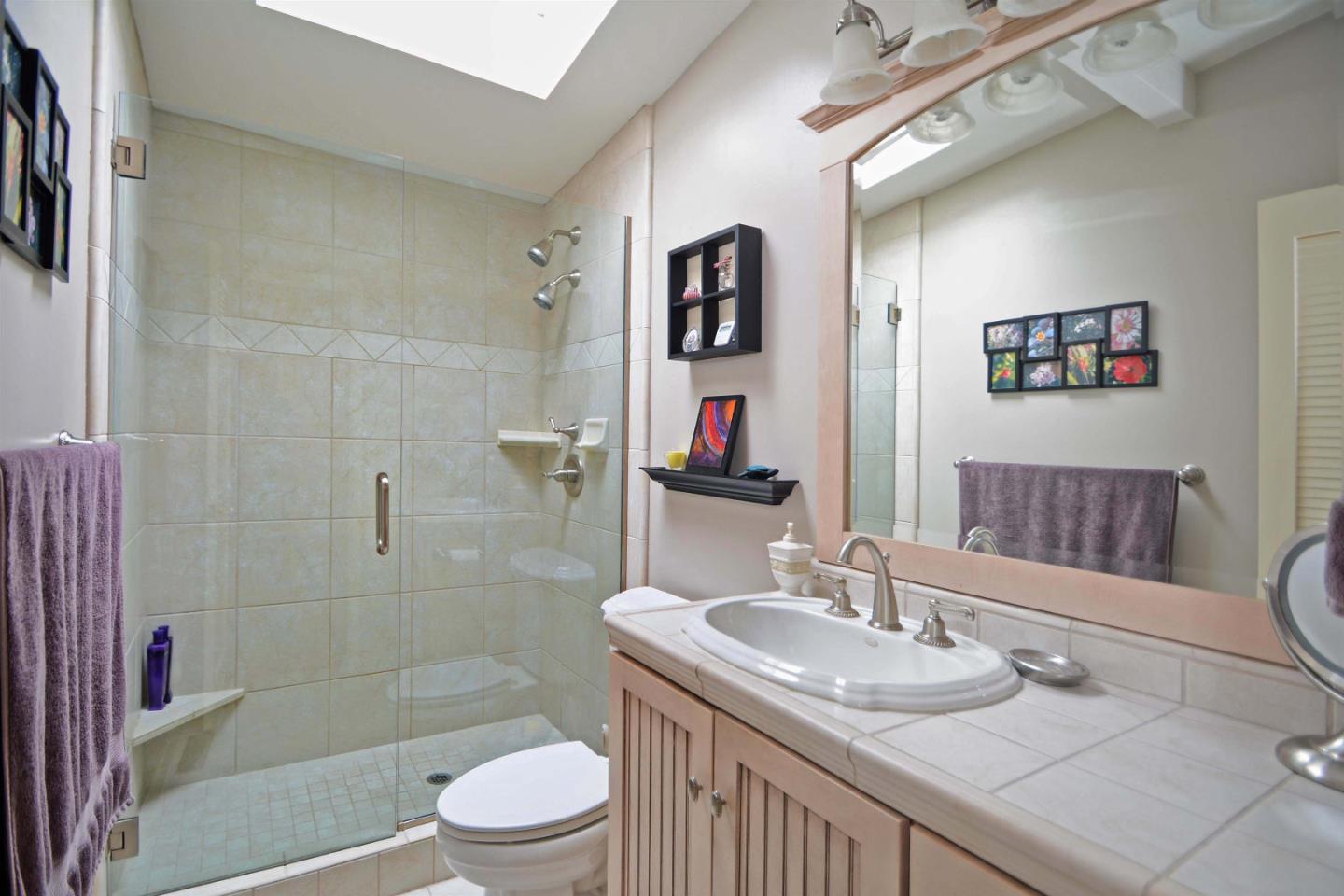 55 Paso Cresta Carmel Valley, CA 93924 - Photo 20 of 26 a bathroom with a granite countertop sink toilet and shower