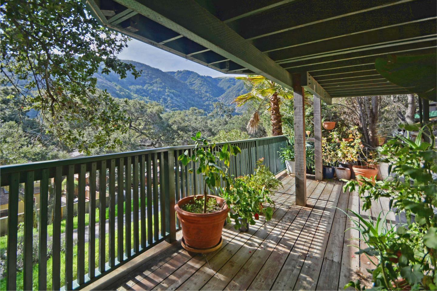 55 Paso Cresta Carmel Valley, CA 93924 - Photo 5 of 26 a balcony with chairs and potted plants