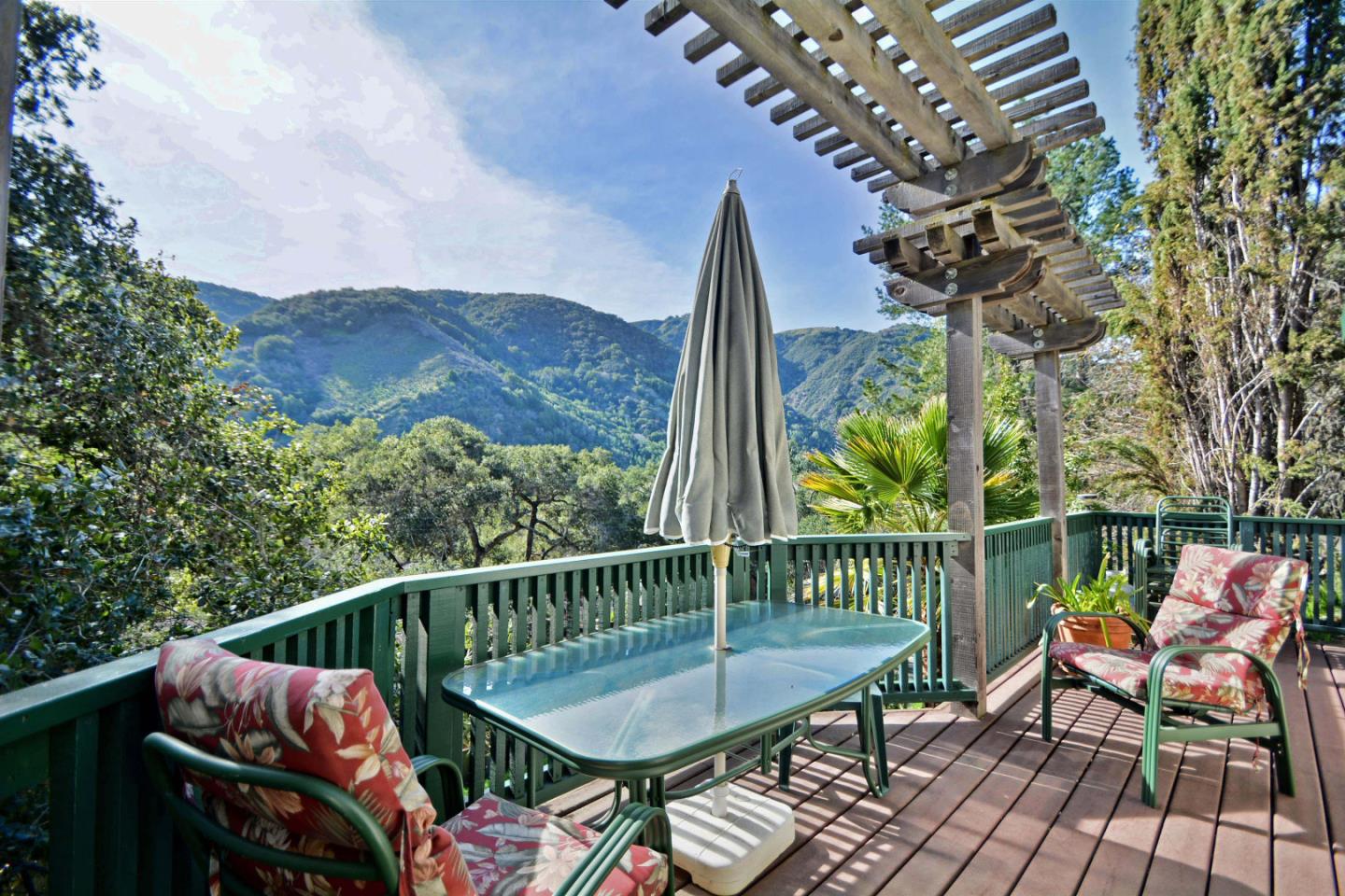 55 Paso Cresta Carmel Valley, CA 93924 - Photo 10 of 26 a view of a wooden chairs and table in patio