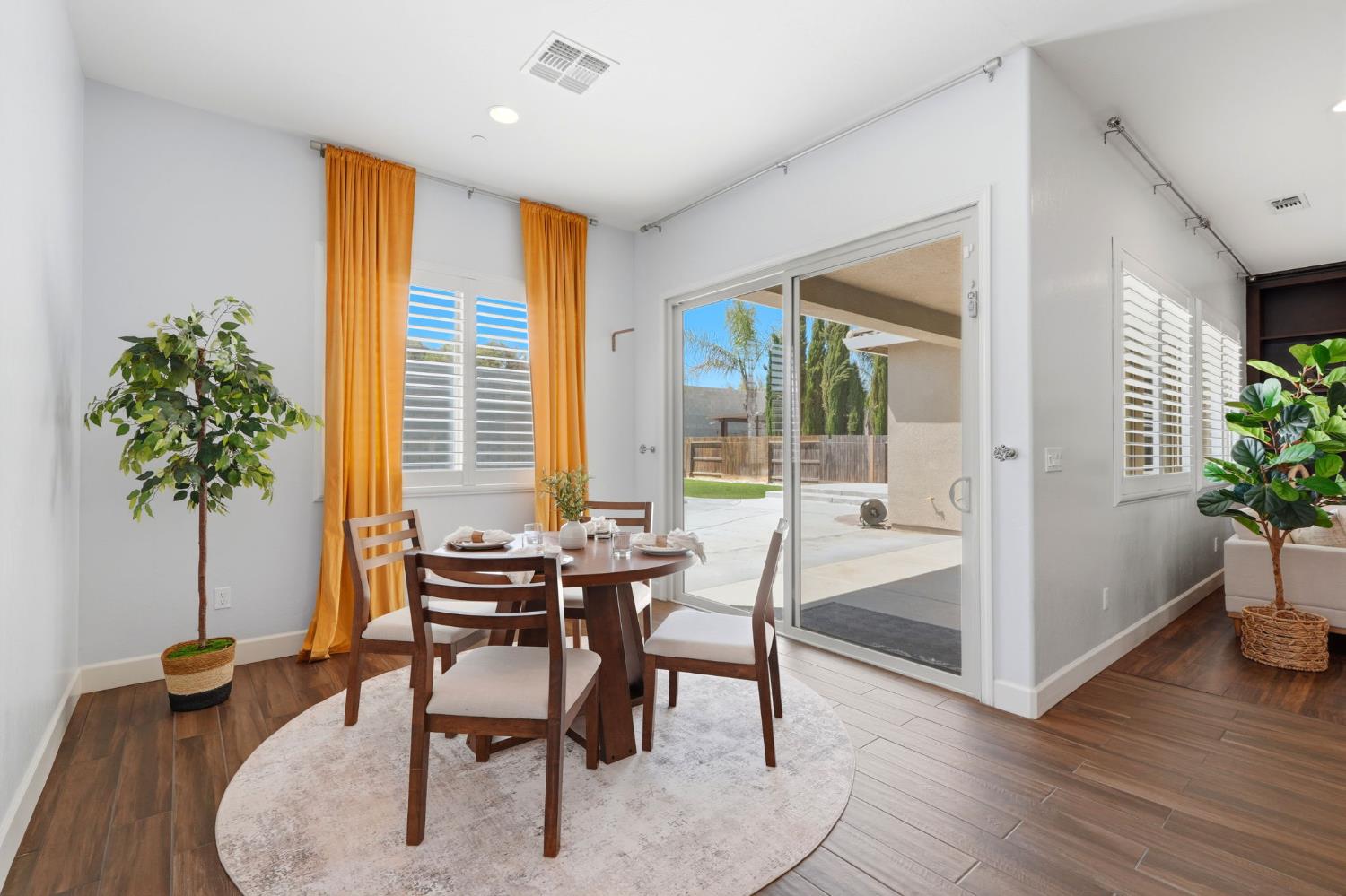 3368 North Discovery Way Hanford, CA 93230 - Photo 17 of 43 a dining room with furniture and wooden floor