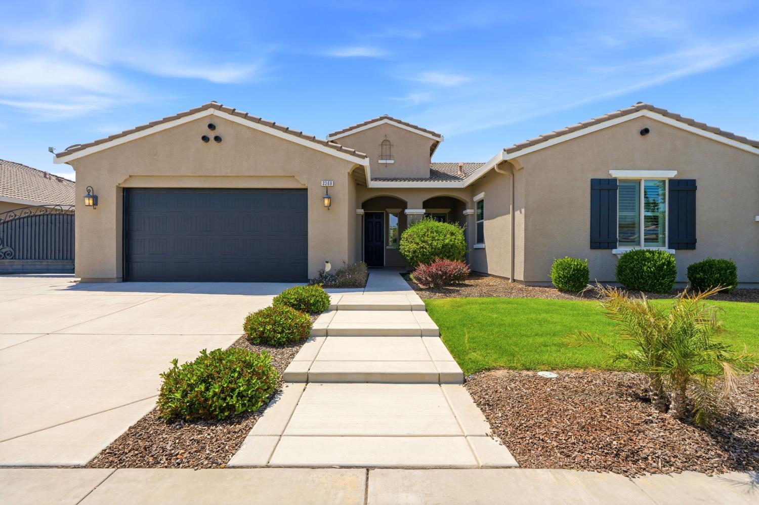 3368 North Discovery Way Hanford, CA 93230 - Photo 2 of 43 a front view of a house with a yard