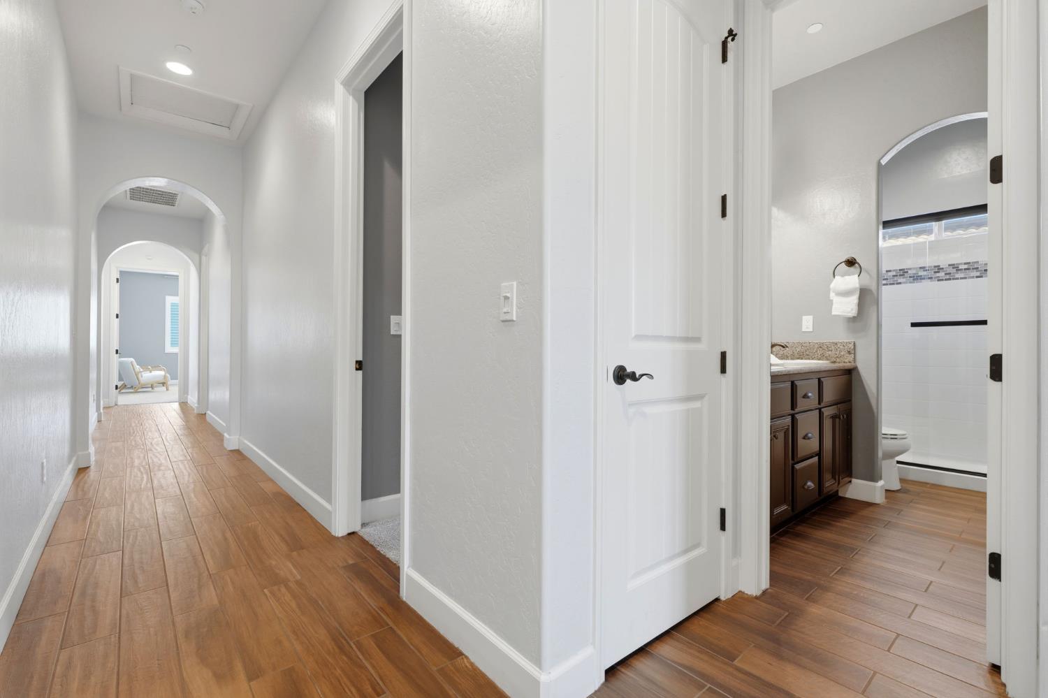 3368 North Discovery Way Hanford, CA 93230 - Photo 28 of 43 a view of a hallway with wooden floor and closet