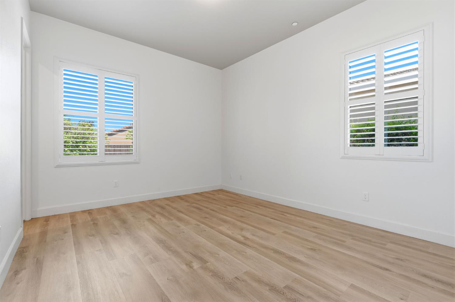 3368 North Discovery Way Hanford, CA 93230 - Photo 30 of 43 a view of an empty room with wooden floor and a window