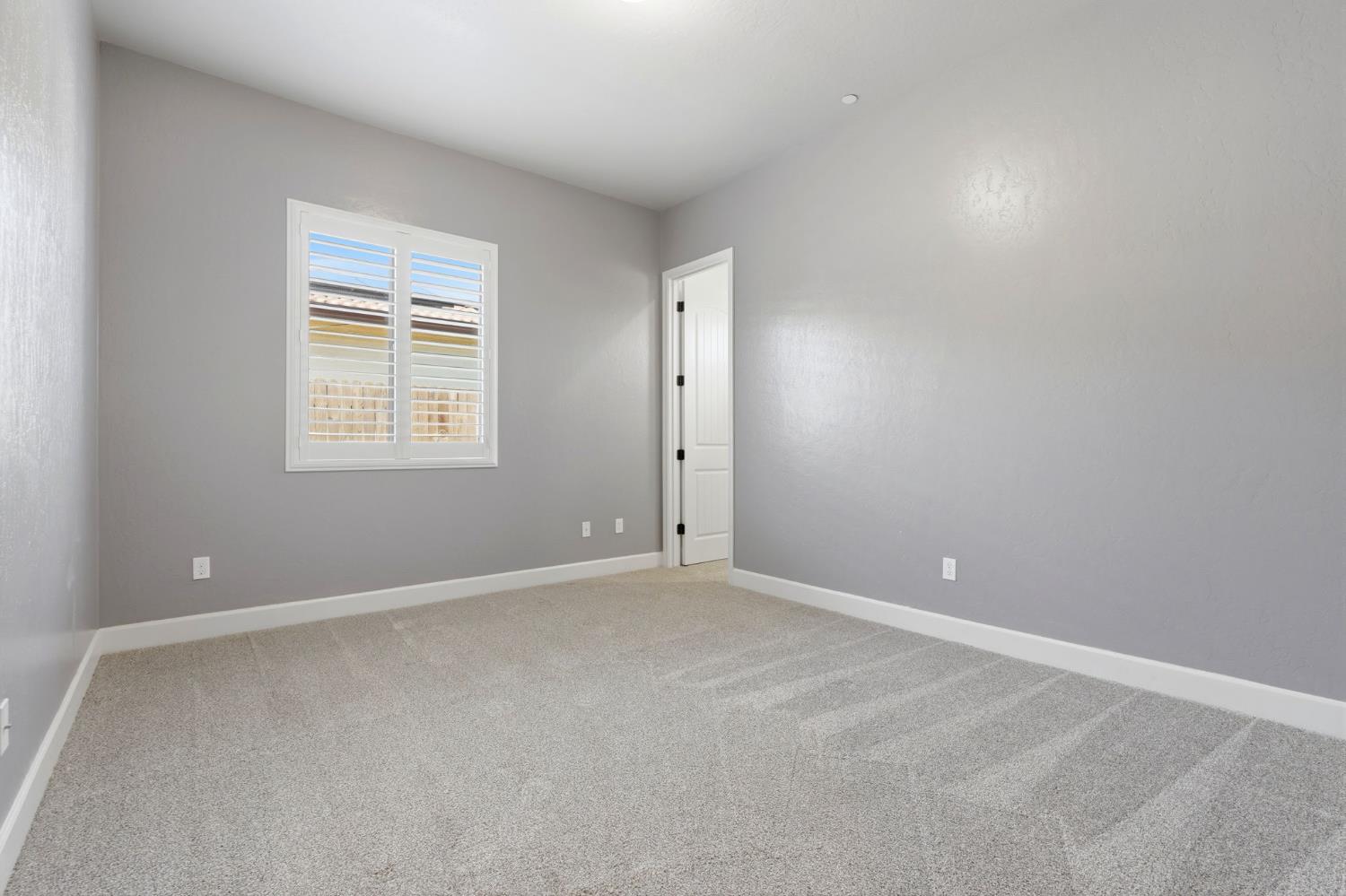 3368 North Discovery Way Hanford, CA 93230 - Photo 32 of 43 an empty room with windows and closet