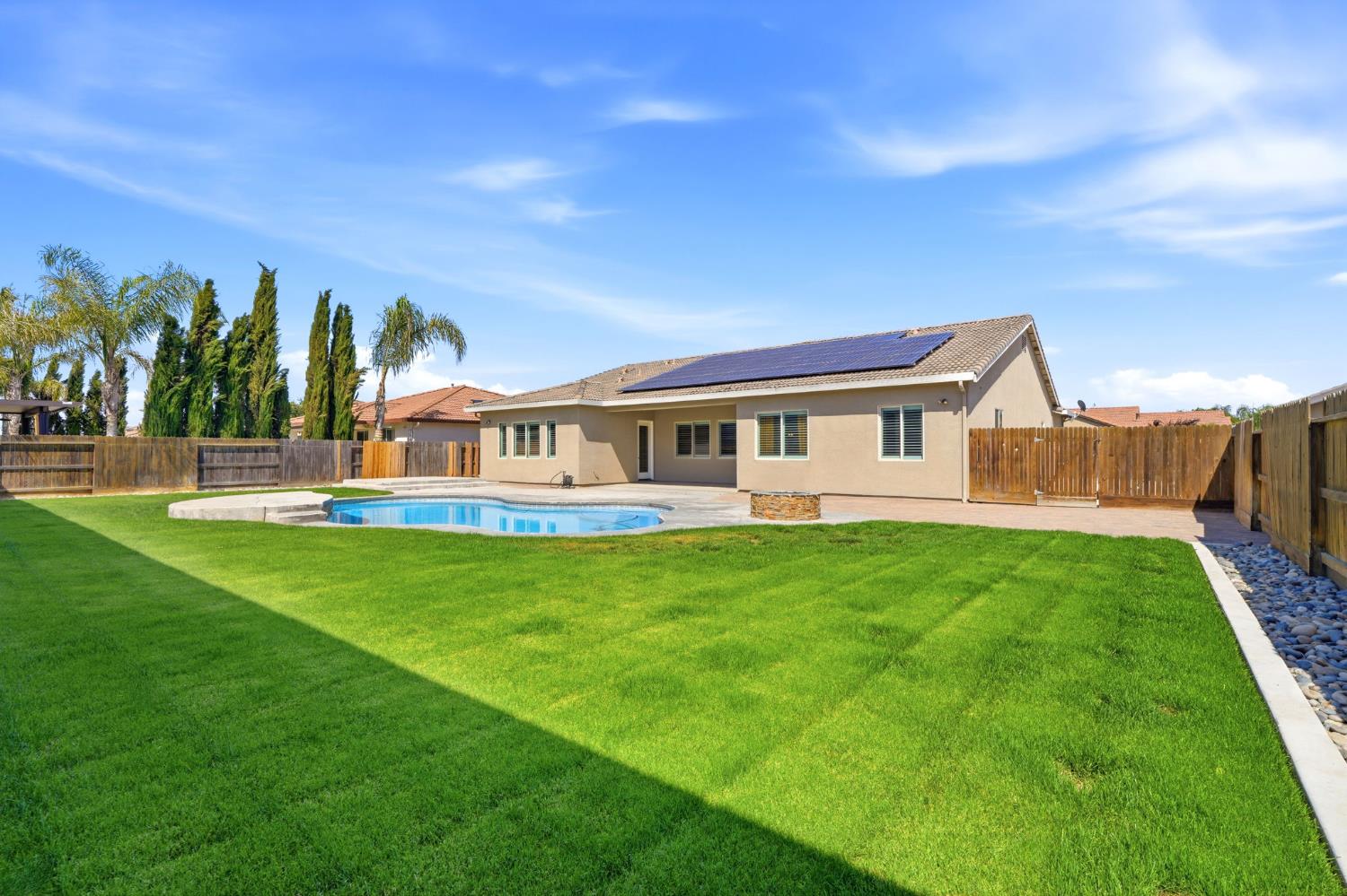 3368 North Discovery Way Hanford, CA 93230 - Photo 38 of 43 a view of a house with backyard and garden