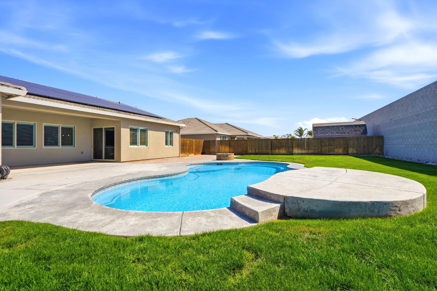 3368 North Discovery Way Hanford, CA 93230 - Photo 40 of 43 a view of outdoor space yard swimming pool and patio