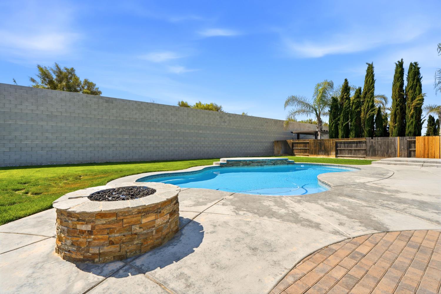 3368 North Discovery Way Hanford, CA 93230 - Photo 41 of 43 a view of a swimming pool with a yard