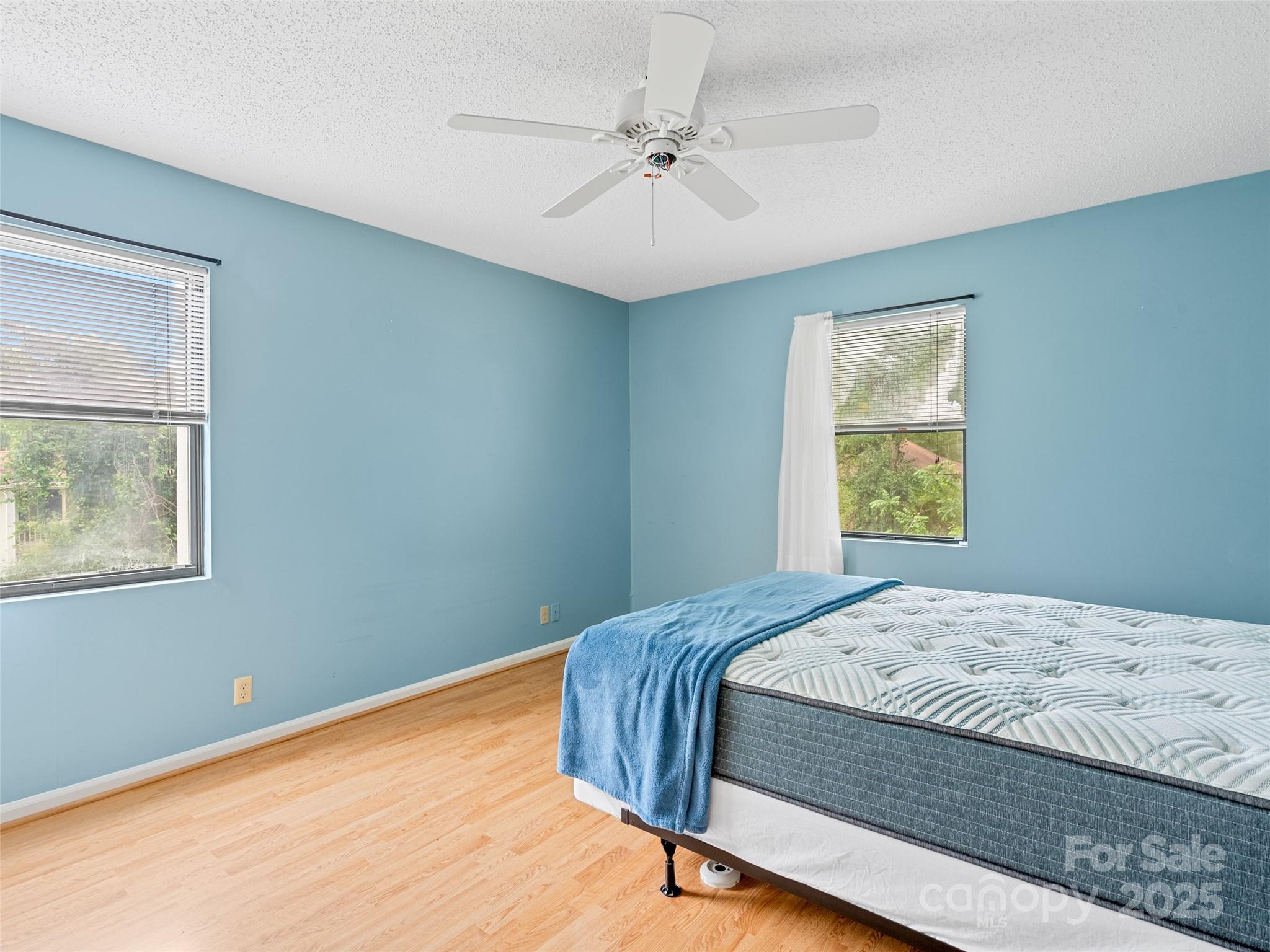110 Heywood Road, Unit 17C Arden, NC 28704 - Photo 17 of 26 a bedroom with a bed and a window