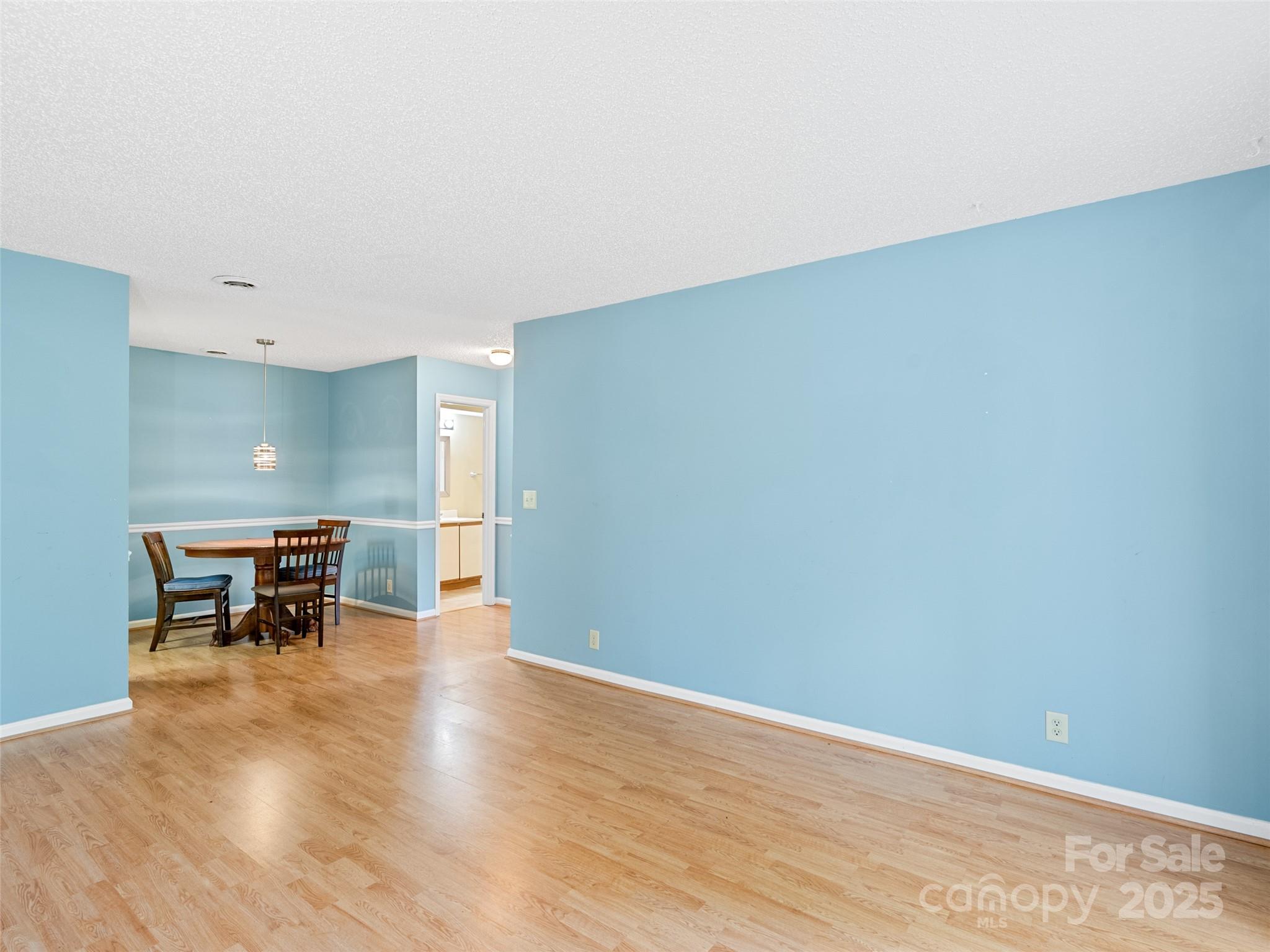 110 Heywood Road, Unit 17C Arden, NC 28704 - Photo 2 of 26 a view of an empty room with wooden floor and a window