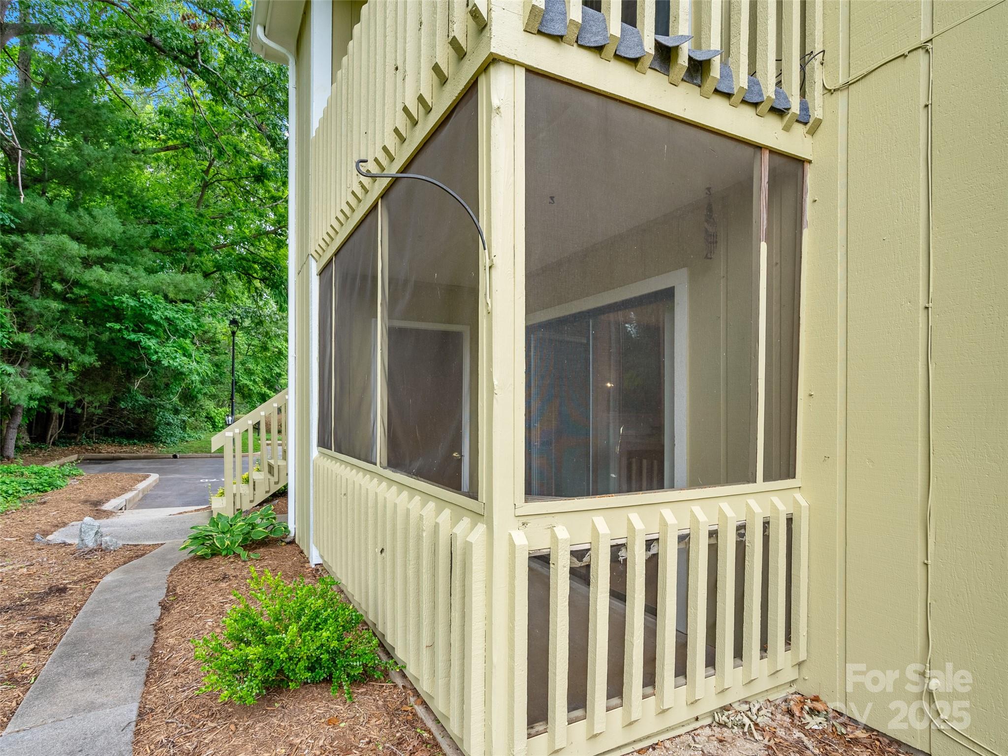 110 Heywood Road, Unit 17C Arden, NC 28704 - Photo 22 of 26 a view of a house with a small yard
