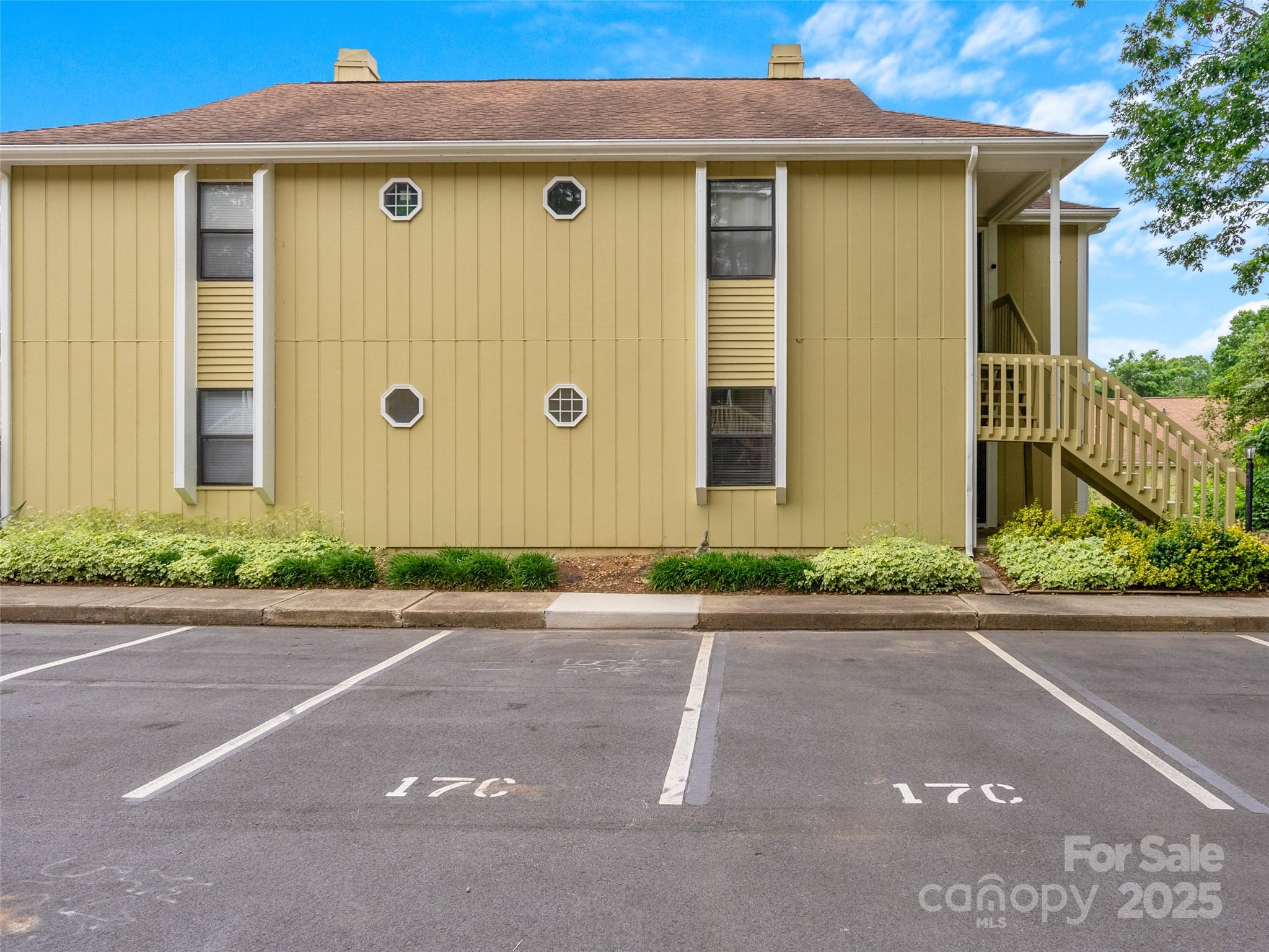 110 Heywood Road, Unit 17C Arden, NC 28704 - Photo 24 of 26 a front view of a house with garden
