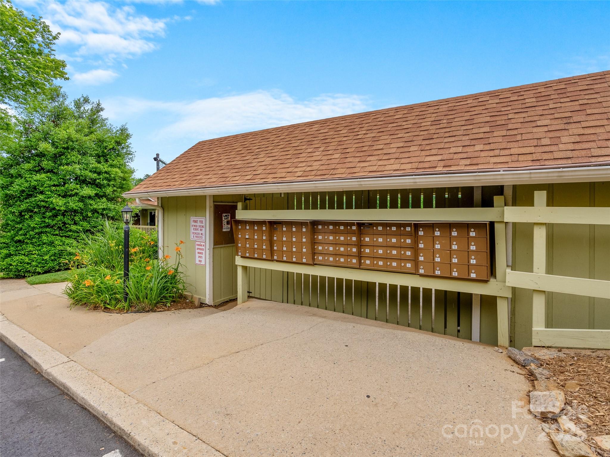 110 Heywood Road, Unit 17C Arden, NC 28704 - Photo 26 of 26 a front view of a house with a yard
