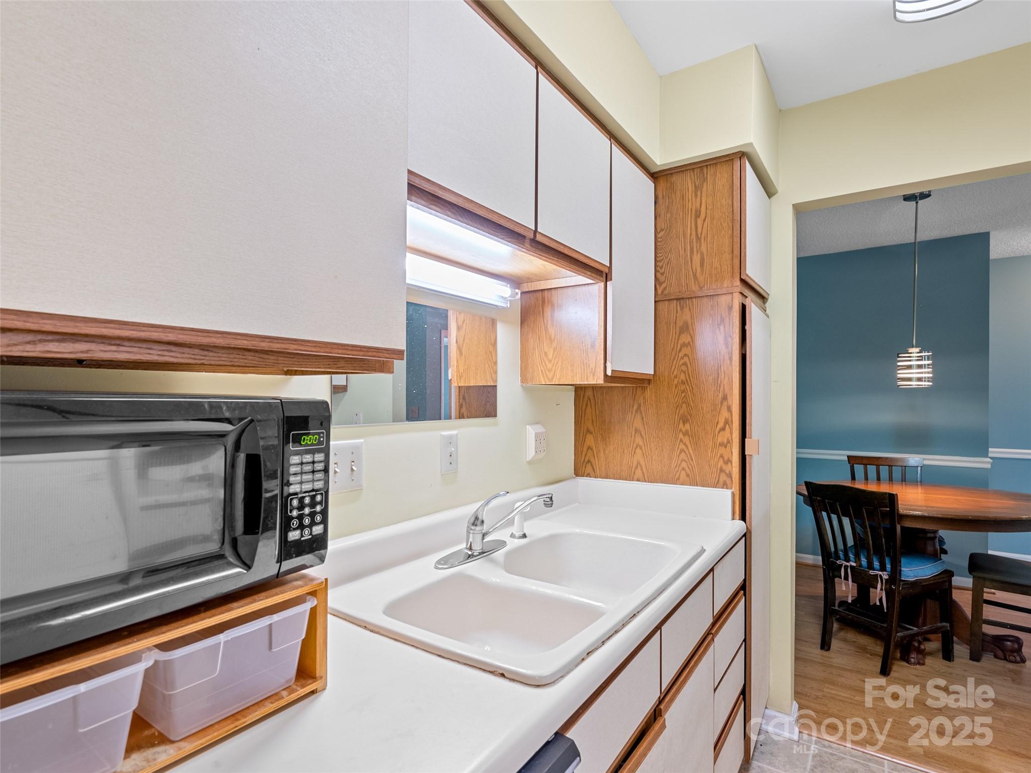 110 Heywood Road, Unit 17C Arden, NC 28704 - Photo 5 of 26 a bathroom with a sink a mirror and a bathtub