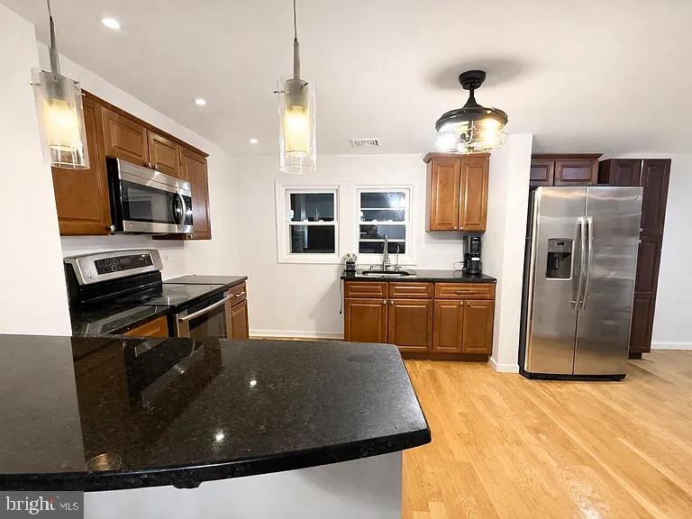 106 Reed Street Hightstown, NJ 08520 - Photo 6 of 14 Modern kitchen with sleek finishes.