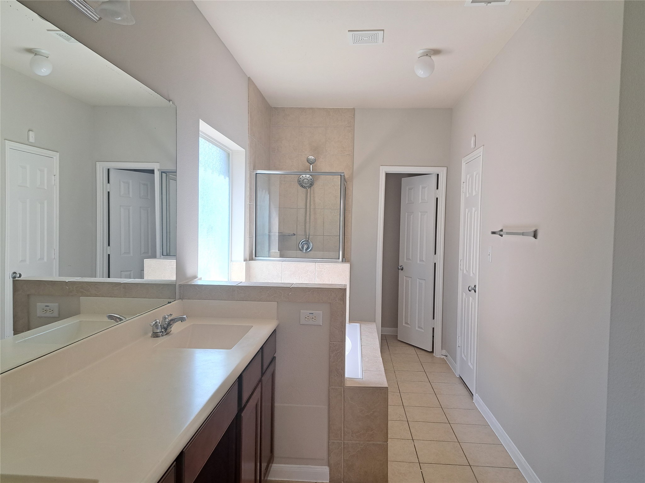 26315 Fox Ridge Lane Katy, TX 77494 - Photo 19 of 39 a spacious bathroom with a granite countertop sink and a mirror